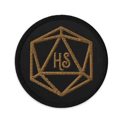 Black circle patch with D20 Harbor Street logo in gold embroidery