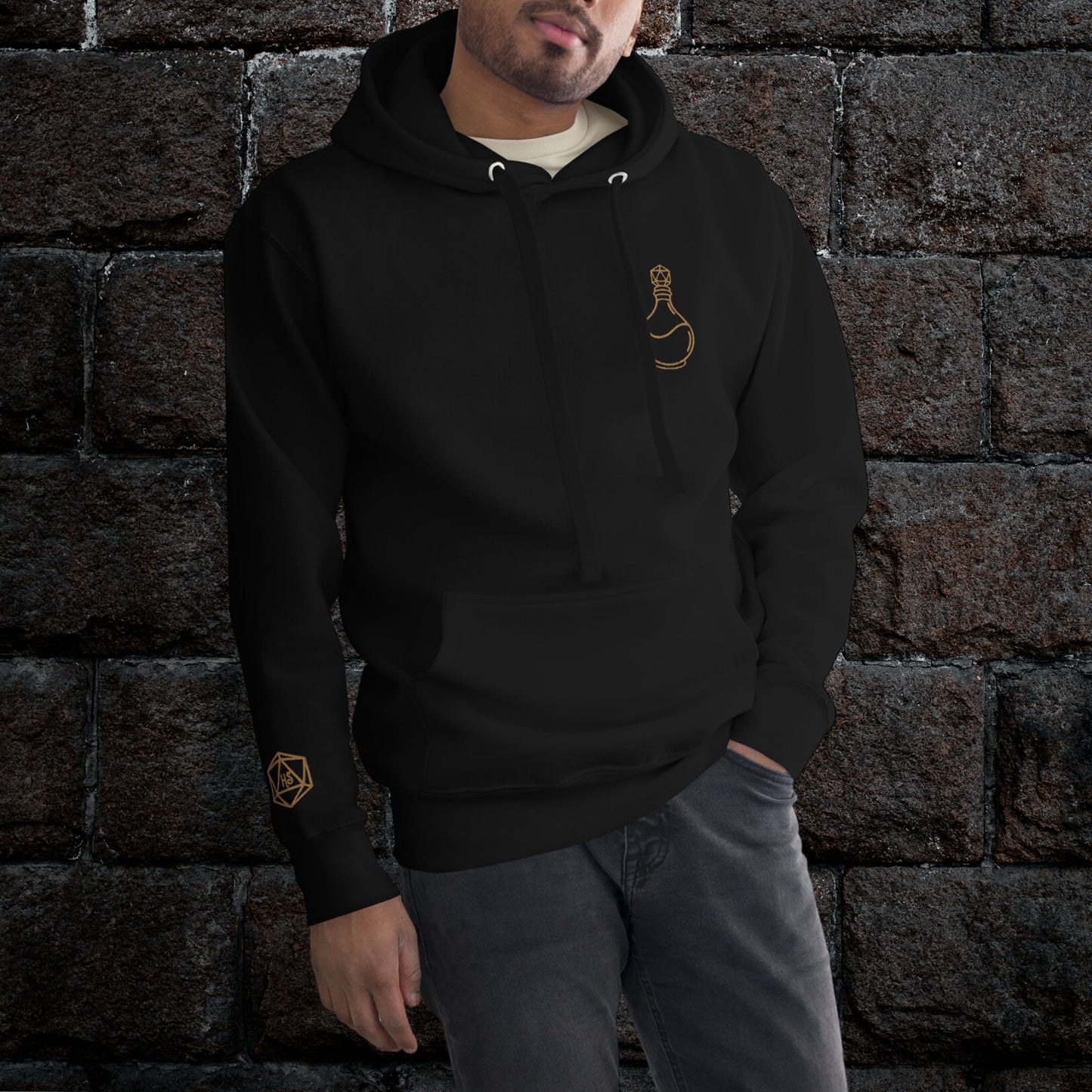 Black hoodie with golden embroidered D20 potion bottle on the left chest and D20 Harbor Street logo on the right wrist